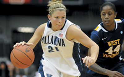 Young woman playing basketball